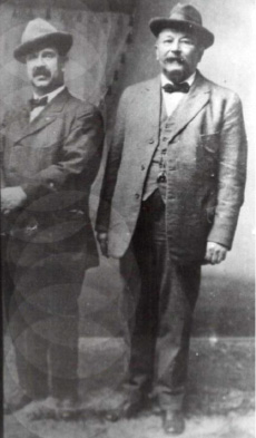Figure 2: Frederick Engelhardt (left) with Benjamin Austin, Peerless' master music maker. This photo is from Austin's album under which was written by Mrs. Austin, "Ben and the big noise."
