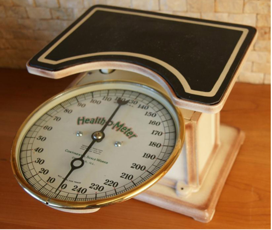 Second model, Health-o-Meter bath scale featuring large clock-face dial.